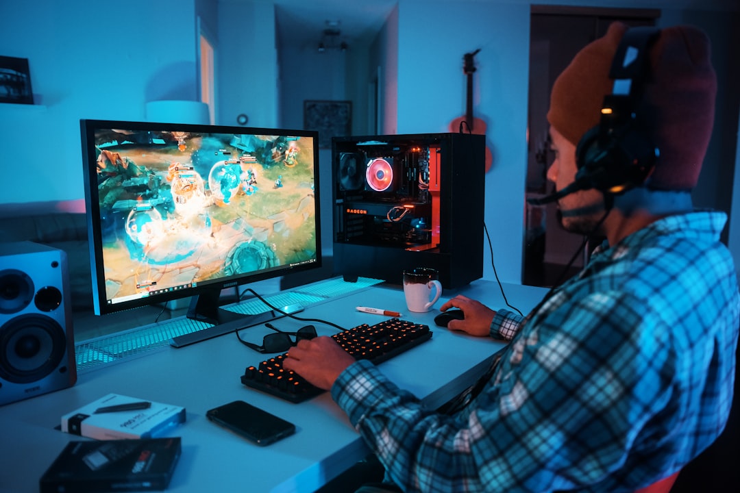 a-person-wearing-headphones-and-using-a-computer-faiwkfvjtz4